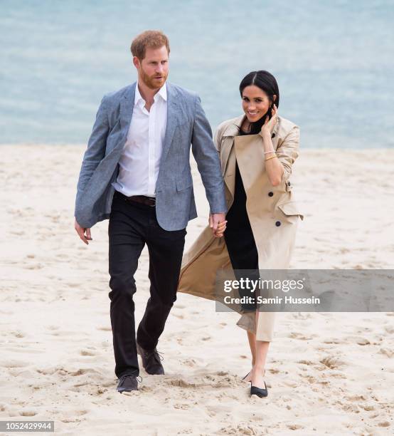 Prince Harry, Duke of Sussex and Meghan, Duchess of Sussex visit South Melbourne Beach on October 18, 2018 in Melbourne, Australia. The Duke and...