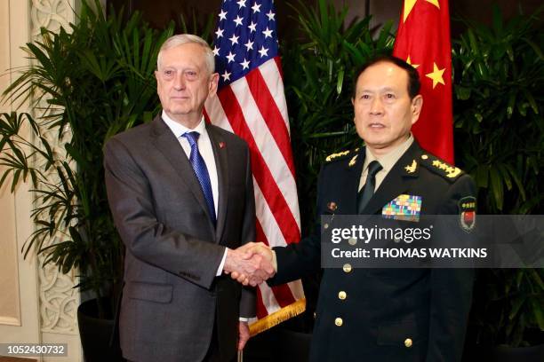 Defence Secretary Jim Mattis shakes hands with his Chinese counterpart General Wei Fenghe during a meeting on the sidelines of the Association of...