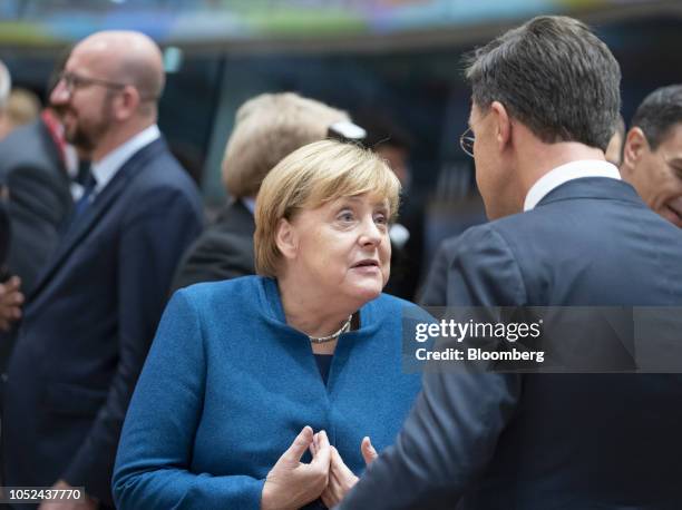 Angela Merkel, Germany's chancellor, center, speaks with Mark Rutte, Netherland's prime minister, during a European Union leaders Brexit summit in...