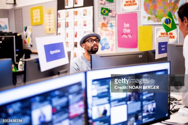 Researcher Andre Souza works in Facebook's "War Room," during a media demonstration on October 17 in Menlo Park, California. - The freshly launched...