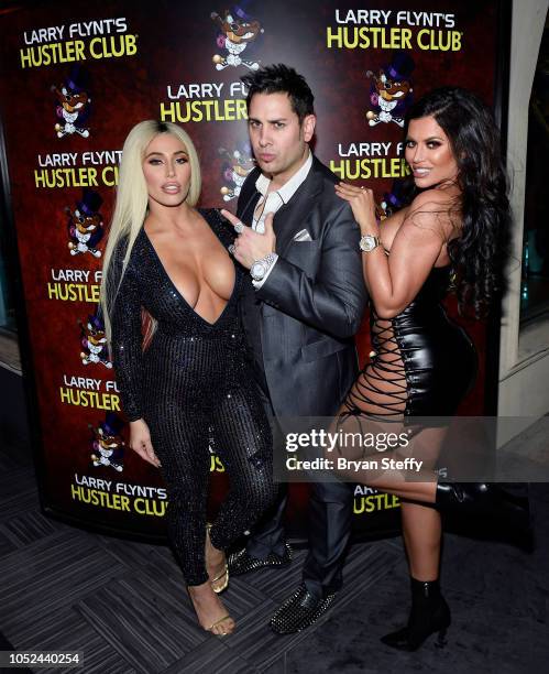 Model Carmen Ortega, producer Dave Bryant and model Toochie Cash celebrate 'National Ass Day' at Larry Flynt's Hustler Club on October 17, 2018 in...