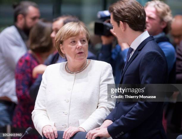 German Chancellor Angela Merkel is talking with the Austrian Chancellor Sebastian Kurz during an EU chief of state summit in the Europa, the EU...