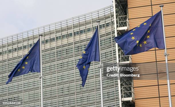 European Union flags fly outside the Berlaymont building, which houses the headquarters of the European Commission, during an EU leaders summit in...