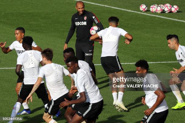 Monaco's French coach Thierry Henry look at his players during a training session in La Turbie, near Monaco on October 18, 2018. - The 41-year-old...