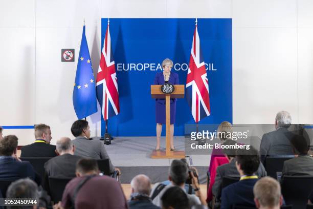 Theresa May, U.K. Prime minister, pauses during a news conference at a European Union leaders summit in Brussels, Belgium, on Thursday, Oct. 18,...