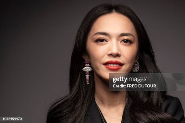 Chinese actress Yao Chen poses for a picture as she attends the French jewellery brand APM Monaco Yao Chen collection launch event in Beijing, on...