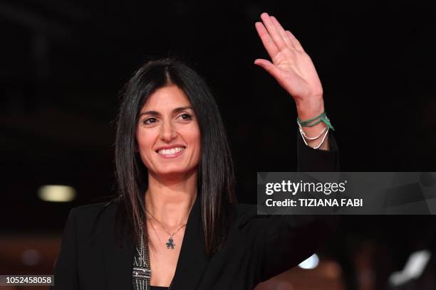 Rome mayor, Virginia Raggi waves as she arrives for the opening of the 2018 Rome Film Festival on October 18, 2018 at the Auditorium Parco della...