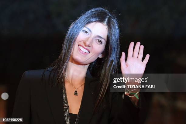 Rome mayor, Virginia Raggi waves as she arrives for the opening of the 2018 Rome Film Festival on October 18, 2018 at the Auditorium Parco della...