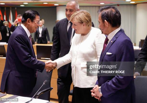 Cambodia's Prime Minister Hun Sen, Bulgarian Prime Minister Boyko Borisov, Chancellor of Germany Angela Merkel and Sultan of Brunei Haji Hassanal...