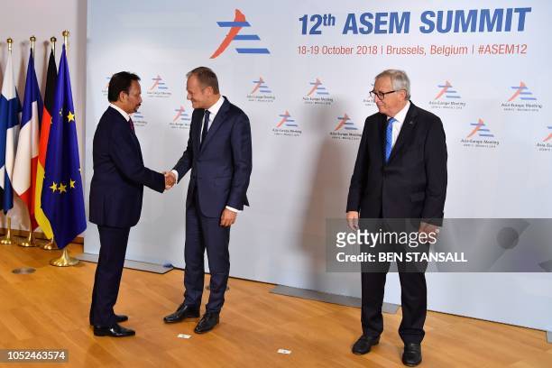 President of the European Commission Jean-Claude Juncker and European Council President Donald Tusk welcome Brunei's Darussalam's Sultan Haji...