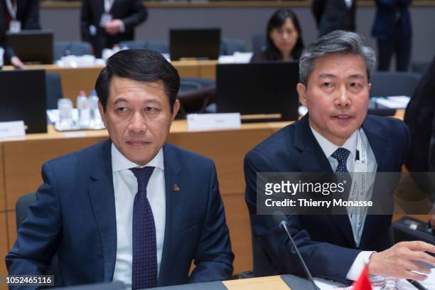 Minister of Foreign Affairs of Laos Saleumxay Kommasith and the President of South Korea Moon Jae-in are waiting during an Asia-Europe Meeting , on...