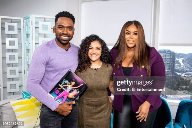 Episode 181018 -- Pictured: Daily Pop Host Justin Sylvester poses along side Olympic Gold Medalist Laurie Hernandez, and Host Nina Parker --