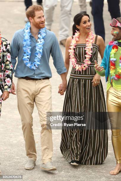 Prince Harry, Duke of Sussex and Meghan, Duchess of Sussex meet Grant Trebilco and Sam Schumacher, founder and co-founder of OneWave, a local surfing...