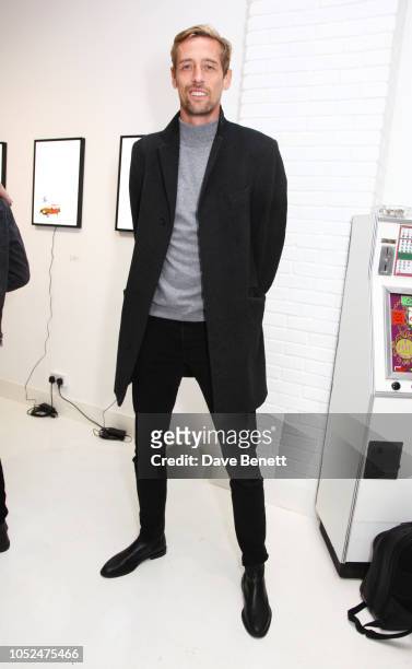 Peter Crouch attends a private view of "Daft Apeth" by Serge Pizzorno of Kasabian at No Ho Showrooms on October 18, 2018 in London, England.