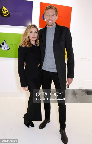 Abbey Clancy and Peter Crouch attend a private view of "Daft Apeth" by Serge Pizzorno of Kasabian at No Ho Showrooms on October 18, 2018 in London,...