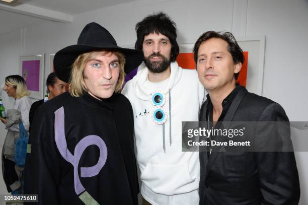 Noel Fielding, Serge Pizzorno and Carl Barat attend a private view of "Daft Apeth" by Serge Pizzorno of Kasabian at No Ho Showrooms on October 18,...