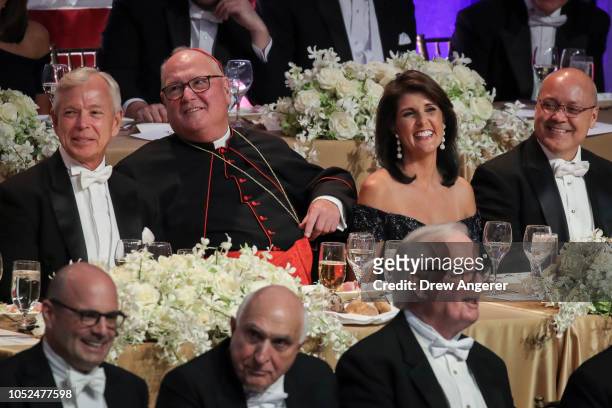 Lowell McAdam, CEO of Verizon, Archbishop of New York Cardinal Timothy Dolan, U.S. Ambassador to the United Nations Nikki Haley and her husband...