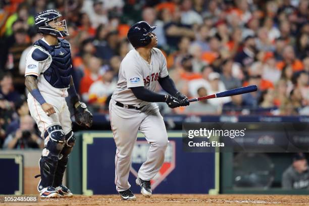 Rafael Devers of the Boston Red Sox reacts after hitting a three-run home run in the sixth inning against the Houston Astros during Game Five of the...