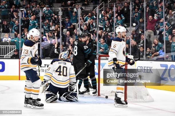 Timo Meier and Joonas Donskoi of the San Jose Sharks celebrate scoring a goal against the Buffalo Sabres at SAP Center on October 18, 2018 in San...