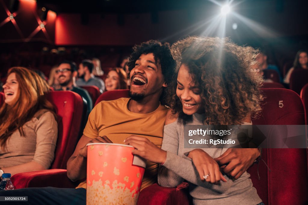 Couple in love hugging at cinema