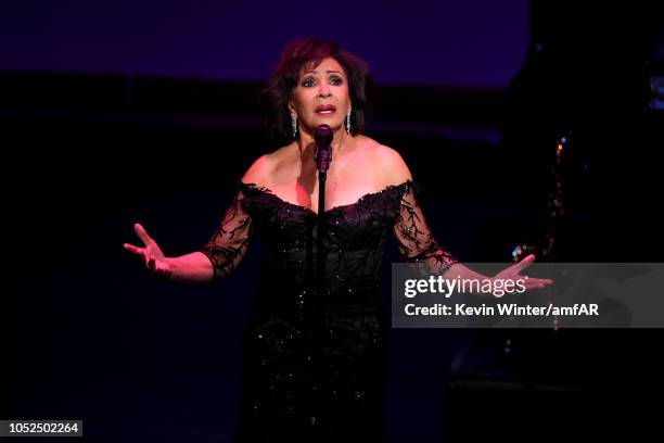 Dame Shirley Bassey performs onstage at the amfAR Gala Los Angeles 2018 at Wallis Annenberg Center for the Performing Arts on October 18, 2018 in...