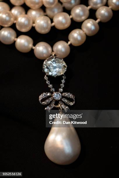 An 18th century Pearl Diamond pendant previously belonging to Marie Antoinette is displayed at Sotheby's auction house on October 19, 2018 in London,...