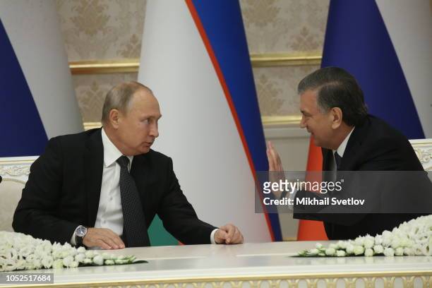 Russian President Vladimir Putin listens to Uzbek President Shavkat Mirziyoyev during their talks in Tashkent, Uzbekistan, October 2018. Vladimir...
