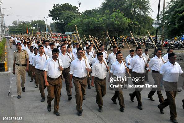 RSS workers take part in a foot march on the occasion of Vijay Dashmi ...