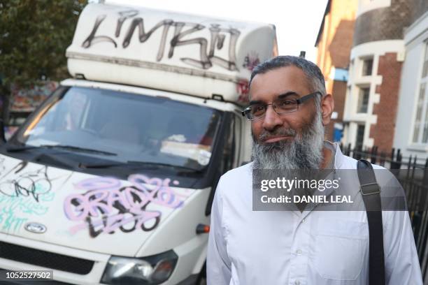 Radical cleric Anjem Choudary is seen leaving a probation hostel in London on October 19, 2018 following his release from prison. - Radical cleric...