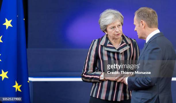 Prime Minister of the United Kingdom Theresa May talks with the President of the European Council Donald Franciszek Tusk after the family photo of...