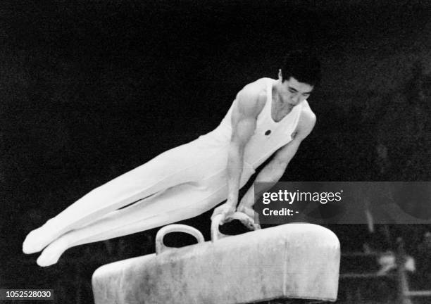 Japanese gymnast Sawao Kato performs on the pommel horse during the men's artistic gymnastics individual all-around final on October 24, 1968 in...