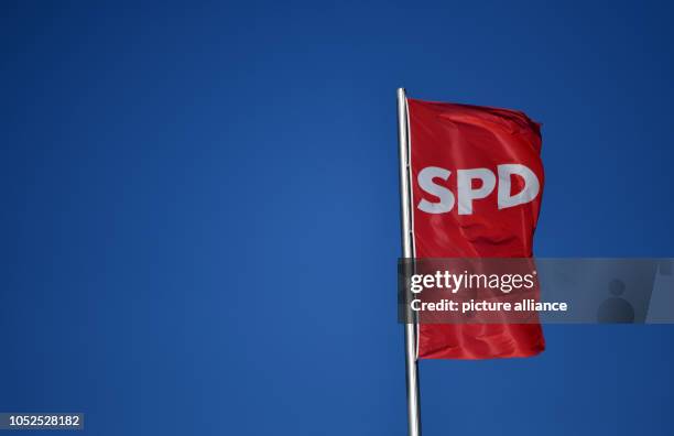 January 2017, Berlin: 05 January 2017, Germany, Berlin: The SPD flag is flying on the Willy Brandt House in Berlin. Photo: Ralf Hirschberger/dpa