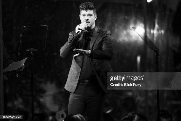 Robin Thicke speaks onstage during the amfAR Gala Los Angeles 2018 at Wallis Annenberg Center for the Performing Arts on October 18, 2018 in Beverly...