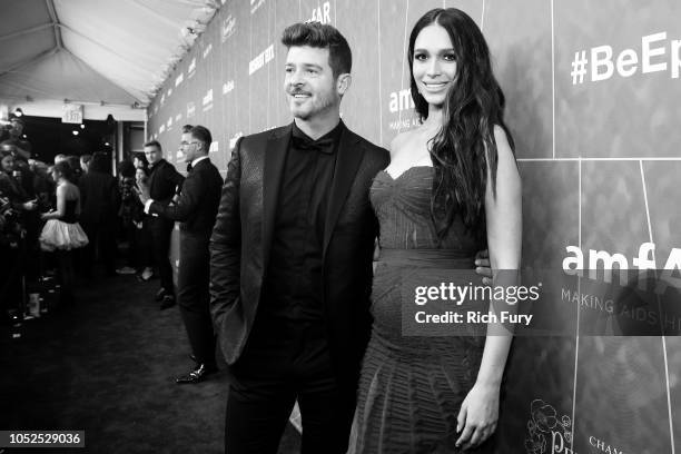 Robin Thicke and April Love Geary attend the amfAR Gala Los Angeles 2018 at Wallis Annenberg Center for the Performing Arts on October 18, 2018 in...