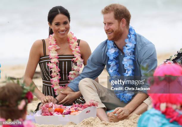 Prince Harry, Duke of Sussex and Meghan, Duchess of Sussex talk to members of OneWave, an awareness group for mental health and wellbeing at South...