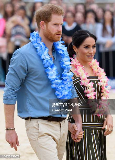 Prince Harry, Duke of Sussex and Meghan, Duchess of Sussex visit Bondi beach on October 19, 2018 in Sydney, Australia. The Duke and Duchess of Sussex...
