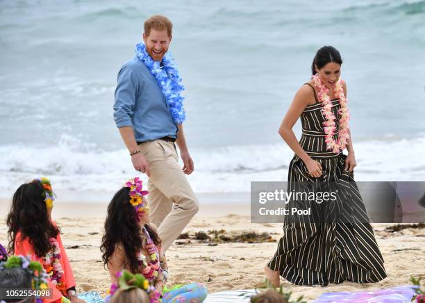 Prince Harry, Duke of Sussex and Meghan, Duchess of Sussex visit Bondi beach on October 19, 2018 in Sydney, Australia. The Duke and Duchess of Sussex...