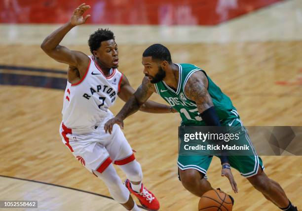 Toronto Raptors guard Kyle Lowry defends against Boston Celtics forward Marcus Morris . Toronto Raptors vs Boston Celtics in 1st half action of NBA...