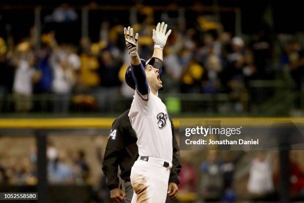 Ryan Braun of the Milwaukee Brewers celebrates after hitting an RBI double to score Christian Yelich against Hyun-Jin Ryu of the Los Angeles Dodgers...