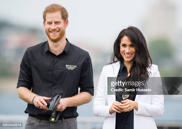 Prince Harry, Duke of Sussex and Meghan, Duchess of Sussex attend the Jaguar Land Rover Driving Challenge at the Invictus Games on October 20, 2018...