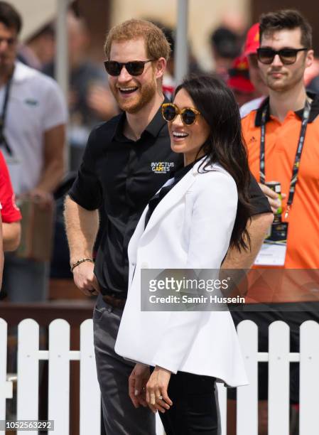 Prince Harry, Duke of Sussex and Meghan, Duchess of Sussex attend the Jaguar Land Rover Driving Challenge at the Invictus Games on October 20, 2018...