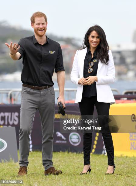 Prince Harry, Duke of Sussex and Meghan, Duchess of Sussex attend the Invictus Games Sydney 2018 Jaguar Land Rover Driving Challenge on Cockatoo...
