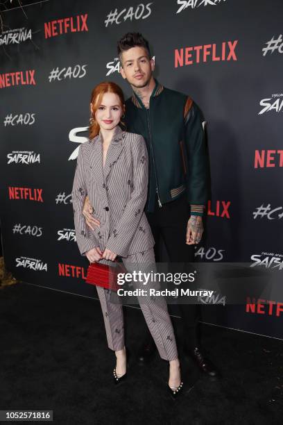 Madelaine Petsch and Travis Mills attend Netflix Original Series "Chilling Adventures of Sabrina" red carpet and premiere event on October 19, 2018...