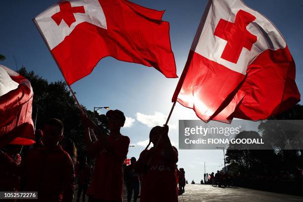 Tongan fans bear flags as they arrive ahead of the rugby league international Test match between Australia and Tonga at Mt Smart Stadium in Auckland...