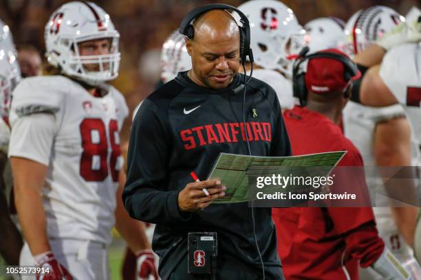 Stanford Cardinal head coach David Shaw looks at his plays during the college football game between the Stanford Cardinal and the Arizona State Sun...
