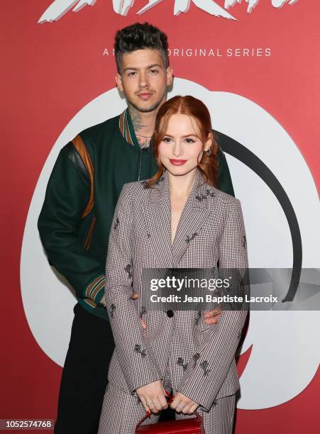 Madelaine Petsch and Travis Mills attend the premiere of Netflix's 'Chilling Adventures of Sabrina' at Hollywood Athletic Club on October 19, 2018 in...