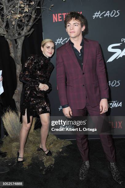 Actress Kiernan Shipka photobombs costar/actor Ross Lynch at the Premiere Of Netflix's "Chilling Adventures Of Sabrina" held at The Hollywood...
