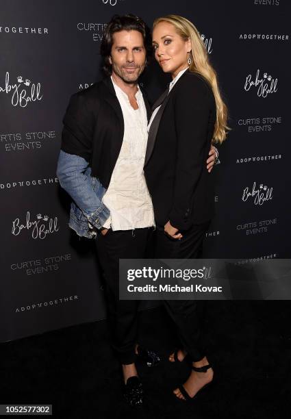 Greg Lauren and Elizabeth Berkley attend the 4th Adopt Together Baby Ball Gala on October 19, 2018 in Los Angeles, California.