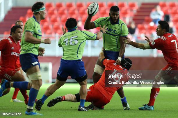 Maritino Nemani of NEC Green Rockets is tackled by Hiroya Sawai of Kobelco Steelers during the rugby Top League match between Kobelco Steelers and...