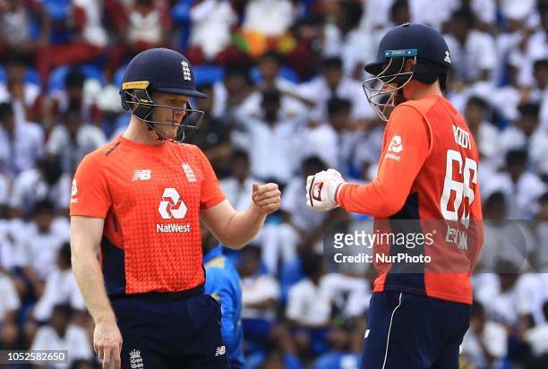 England cricketers Joe Root and Eoin Morgan share a light moment during the 4th One Day International cricket match between Sri Lanka and England at...